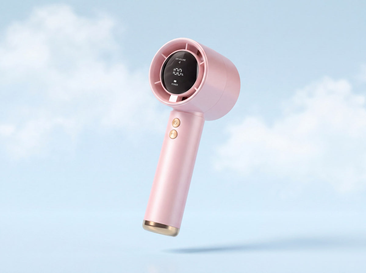 Frostbite mini turbo fan in soft pink, floating against a pale cloud sky