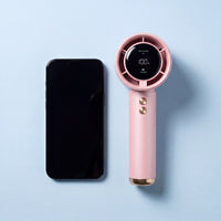 Frostbite fan lying beside an iPhone Pro Max, almost the same length